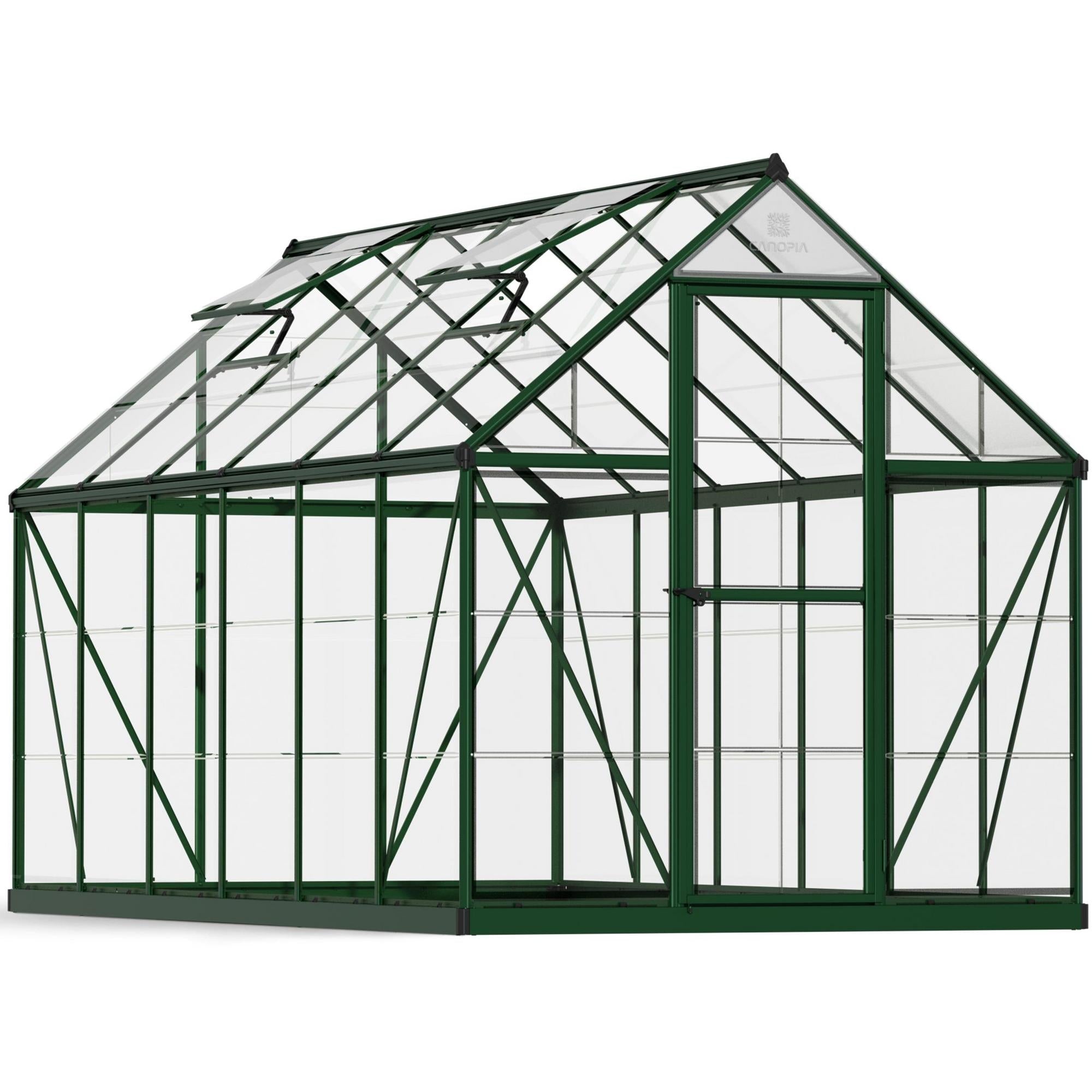 A large greenhouse made up of windows with green framing