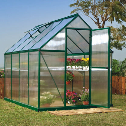 A greenhouse made up of windows with green framing
