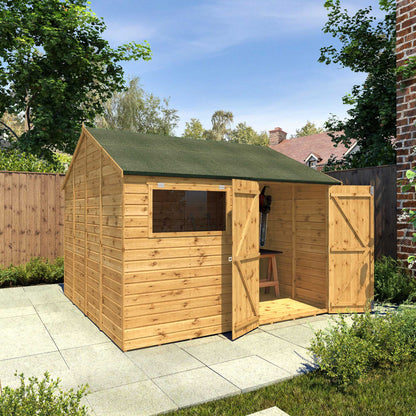A large timber shed with double doors, apex roof and a window